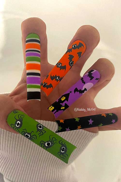 Long multicolored fun Halloween nails with orange, green, purple, and black colors and Halloween nail art designs