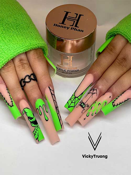 Long nude and neon green Halloween nails with black Halloween nail art designs such as Oogie Boogie, cobwebs, and stitches.