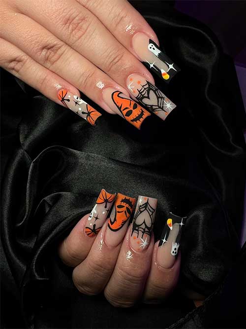 Long square-shaped orange and black Halloween nails with ghosts, pumpkins, and cobwebs.