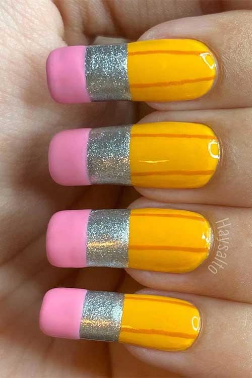 Long square shaped yellow pencil nails with pink erasers