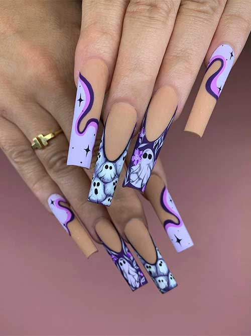 Matte light purple Halloween nails with swirl nail art and ghosts on two accent French tips. Matte light purple Halloween nails with swirl nail art and ghosts on two accent French tips.