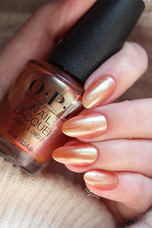 Medium almond shaped bronze pearl nails using OPI #Virgoals from OPI Big Zodiac Energy Collection 2023