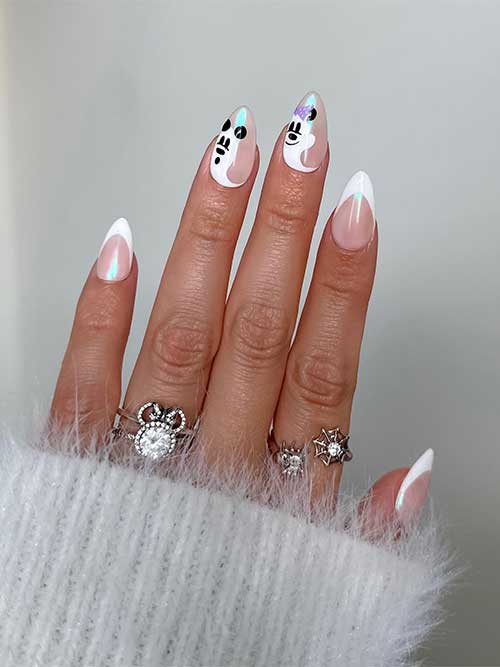 Medium white French tip nails with chrome effect and Mickey and Minnie ghosts on two accent nails. Medium white French tip nails with chrome effect and Mickey and Minnie ghosts on two accent nails.