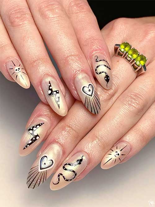 Nude chrome pearl nails with celestial and witchy Halloween nail art designs Nude chrome pearl nails with celestial and witchy Halloween nail art designs