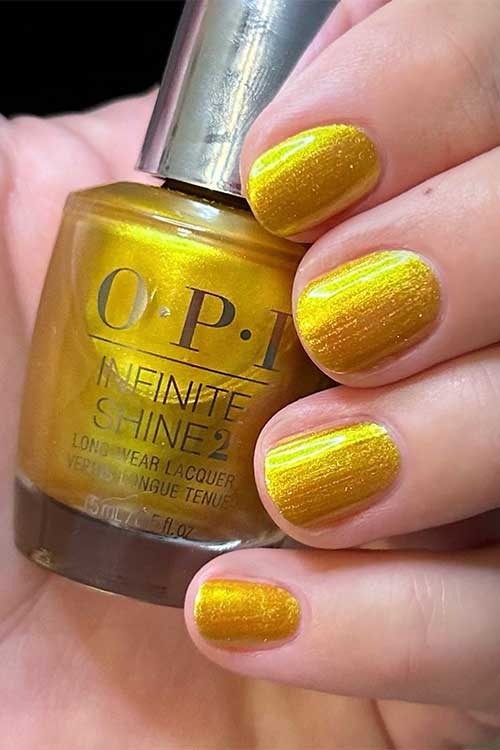 Short bold gold pearl nails using OPI The Leo-nly One from OPI Big Zodiac Energy Collection 2023