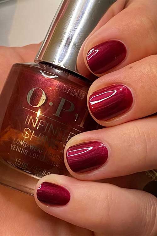 Short burgundy pearl nails using OPI Big Sagittarius Energy from OPI Big Zodiac Energy Collection 2023 Short burgundy pearl nails using OPI Big Sagittarius Energy from OPI Big Zodiac Energy Collection 2023