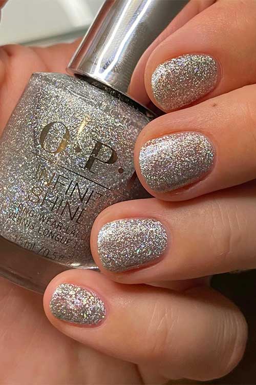 Short holographic silver nails using OPI I Cancer-tainly Shine from OPI Big Zodiac Energy Collection 2023