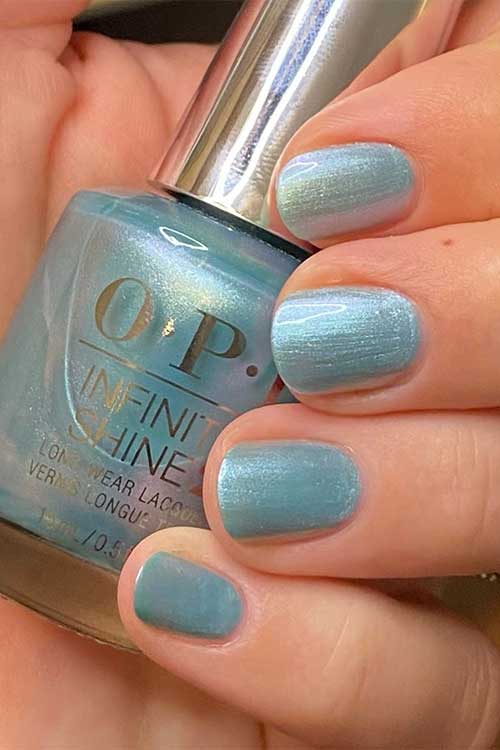 Short light blue pearl nails using OPI Pisces the Future from OPI Big Zodiac Energy Collection 2023