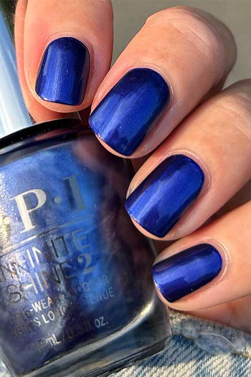 Short navy blue pearl nails using OPI Aquarius Renegade from OPI Big Zodiac Energy Collection 2023