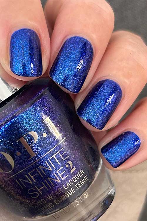 Short shimmer cobalt nails using OPI Scorpio Seduction from OPI Big Zodiac Energy Collection 2023