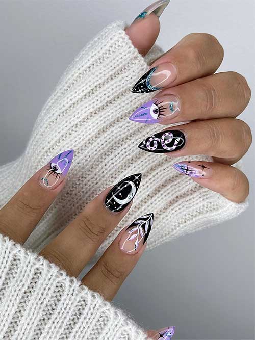 Short stiletto black and purple celestial nails with a little silver glitter. Short stiletto black and purple celestial nails with a little silver glitter.
