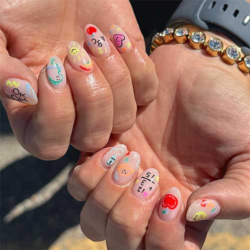 short nude base color nails with different colorful back to school nail art