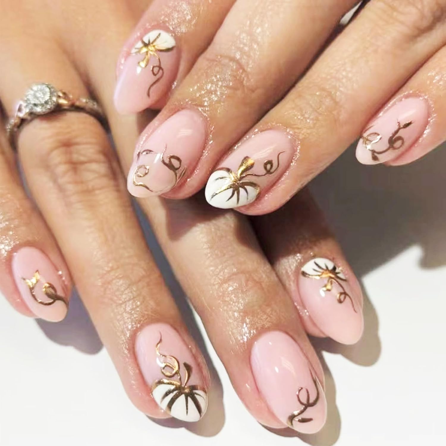 Halloween-themed press-on nails set with 3D pumpkins and gold glitter, designed for a chic and festive manicure look. Halloween-themed press-on nails set with 3D pumpkins and gold glitter, designed for a chic and festive manicure look.
