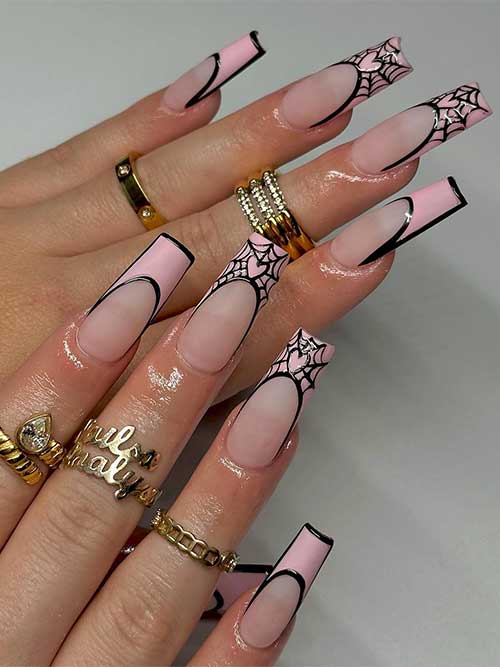 Long French light pink Halloween nails with black outlines and cobwebs on two accent French tips