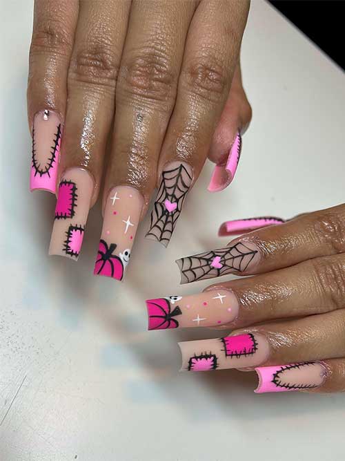 Matte black and pink Halloween nails over nude base color and the design features cobwebs, stitch nail art, and pumpkins Matte black and pink Halloween nails over nude base color and the design features cobwebs, stitch nail art, and pumpkins