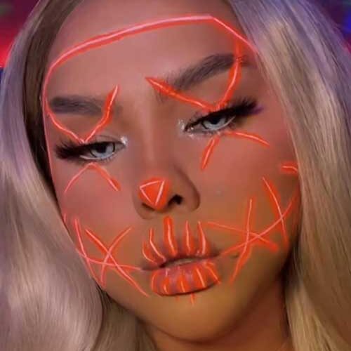 Orange neon purge makeup is one of the best Halloween makeup looks scary in 2023