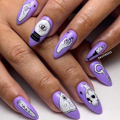 Purple witch nails using stickers such as a spell, a skull, a candle, and a witch hand are perfect purple Halloween nails