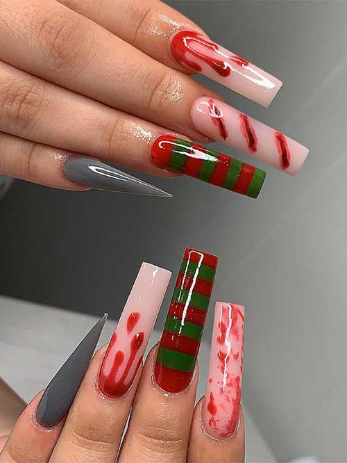 long square-shaped Freddy Krueger Nails with a Freddy Krueger shirt on an accent nail and blood-splatter nail art
