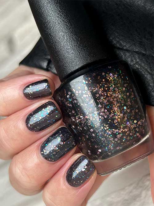 Black multicolored glitter nails using OPI Hot & Coaled nail polish from OPI Terribly Nice Holiday 2023 Collection
