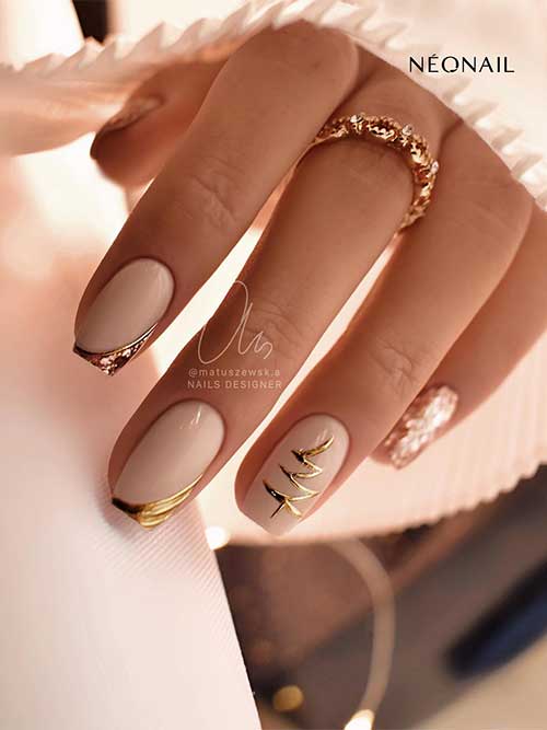 Classy beige Christmas nails with gold diagonal French tips, a gold Christmas tree, and two rose gold glitter accent nails.