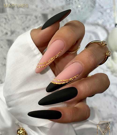 Classy long matte black nails almond shaped with two accent nails with two gold glitter swirl