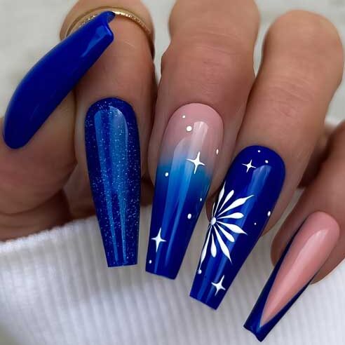 Coffin navy blue Christmas nails with a glittery nail, an ombre nail with white stars, and a big white snowflake on accent