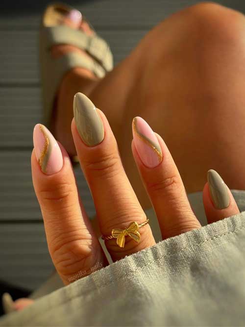 Elegant sage green and blush pink nail design with gold swirls, finished with a glossy topcoat and a gold bow ring. Elegant sage green and blush pink nail design with gold swirls, finished with a glossy topcoat and a gold bow ring.