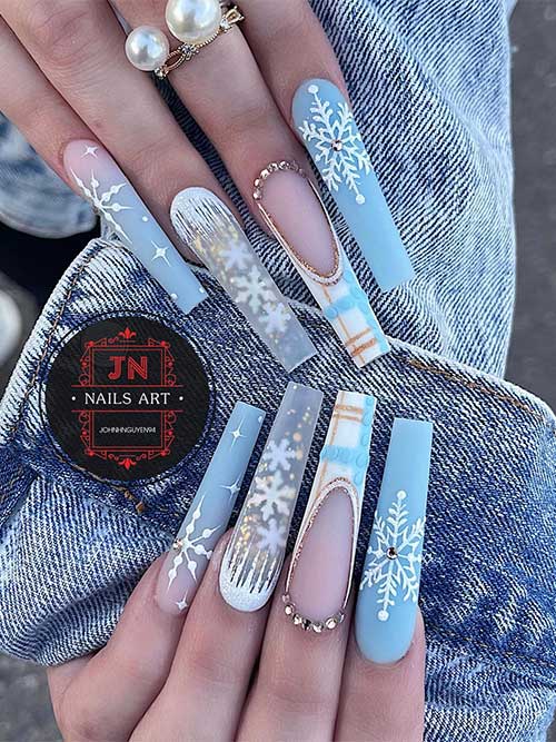 Long coffin matte ice blue winter nails 2023 with white snowflakes adorned with gold rhinestones