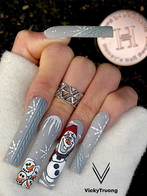 Long gray Christmas nails adorned with sweater nail art, snowflakes, and Olaf nail art.