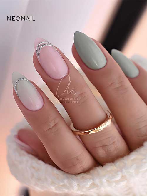 Medium almond sage green nails with nude pink and nude pink to sage green ombre accent nails adorned with silver glitter