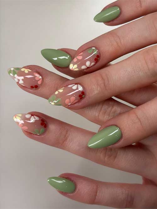 Sage green nails with whimsical pastel flowers on transparent bases, bringing a joyful spring vibe to your fingertips. Sage green nails with whimsical pastel flowers on transparent bases, bringing a joyful spring vibe to your fingertips.