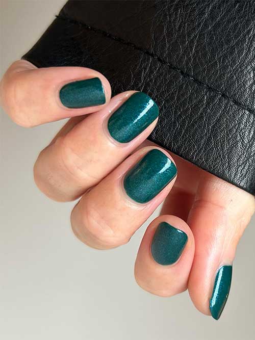 Shimmery teal nails using OPI Let's Scrooge nail polish from OPI Terribly Nice Holiday 2023 Collection