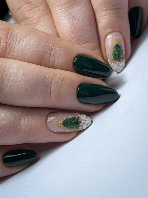  Short dark green nails almond shaped with a nude accent nail adorned with a Christmas tree and white snow