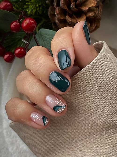 Short dark green nails with two accent nails adorned with white snowflakes and twisted triple French tips as swirls