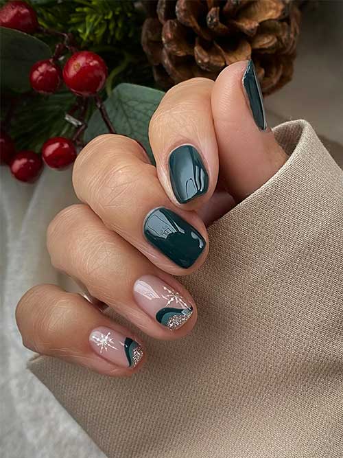 Short dark green nails with two accent nails adorned with white snowflakes and twisted triple French tips as swirls Short dark green nails with two accent nails adorned with white snowflakes and twisted triple French tips as swirls