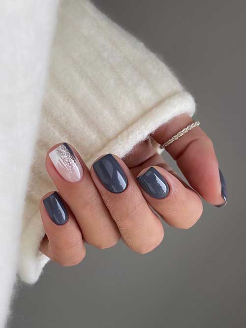 Short grey nails with a nude accent nail adorned with abstract nail art are the best grey nail ideas to try!