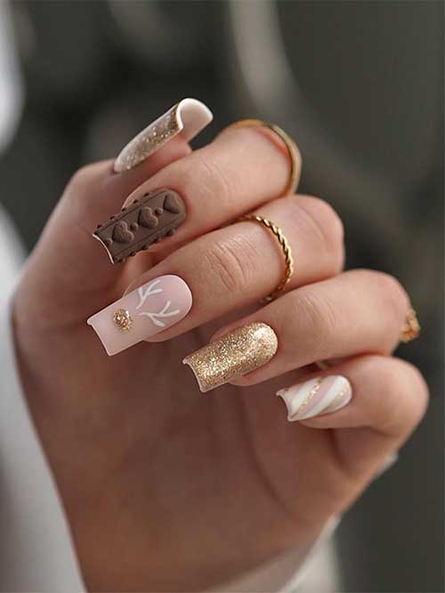 Classy nude and gold glitter Christmas nails with a matte brown sweater nail, and a candy cane accent nail
