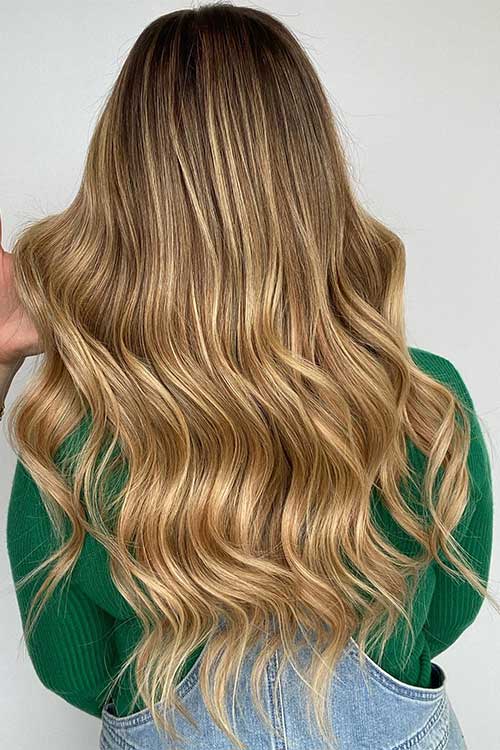 Long balayage blonde hair color is one of the cutest winter hair color ideas to try in 2024