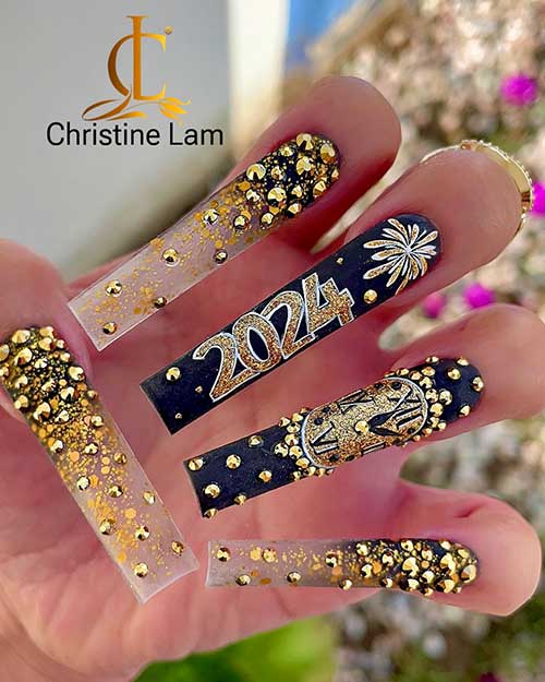 Long square-shaped nude and black New Year’s nails adorned with gold rhinestones with two black festive designs