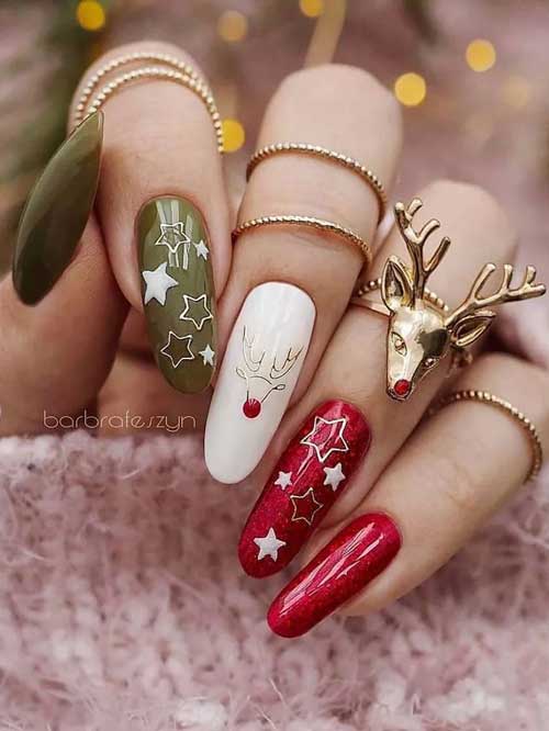Olive green and red Christmas nail design with white stars on an accent olive nail and another accent red nail