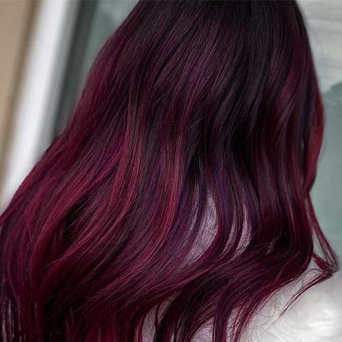 Wine hair color is one of the best winter hair color ideas for 2024