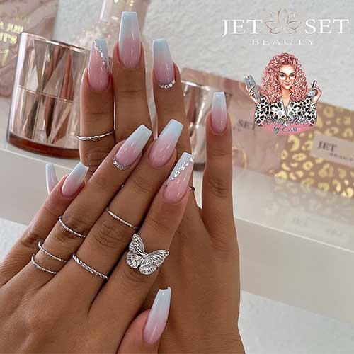 Coffin baby boomer nails with silver rhinestones and a diagonal white French tip accent with a touch of silver foil