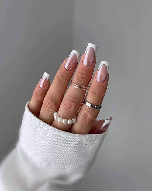 Dazzling long square-shaped white French tip nails that can be done using white chrome powder