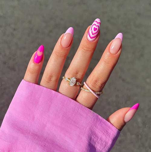 French hot and light pink Valentine’s nails with a hot pink solid nail and a light pink nail with overlapping heart nail art French hot and light pink Valentine’s nails with a hot pink solid nail and a light pink nail with overlapping heart nail art