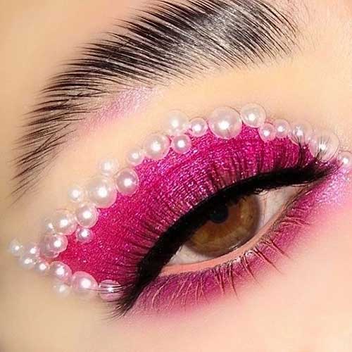 Hot pink Valentine’s Day eye makeup with pearls above the eyeshadow and long lashes Hot pink Valentine’s Day eye makeup with pearls above the eyeshadow and long lashes
