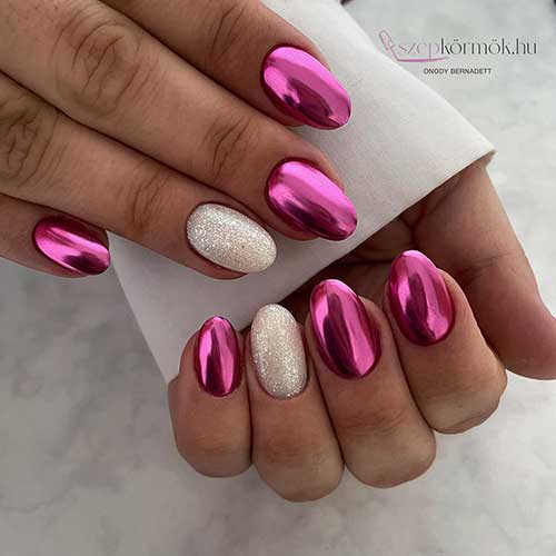 Pink chrome nails with an accent white nail adorned with silver glitter is one of the simplest Valentine's Nails Ideas