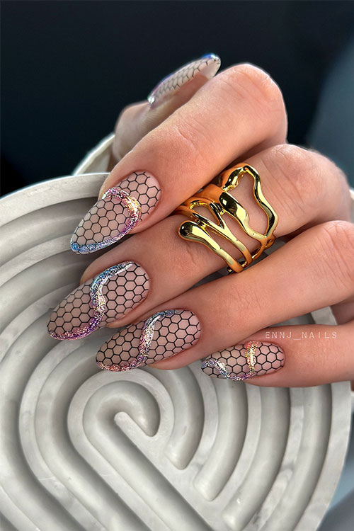 Gorgeous matte black fishnet nails with a creative glitter swirl on each nail. Gorgeous matte black fishnet nails with a creative glitter swirl on each nail.