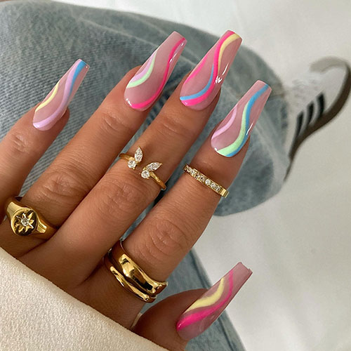 Long coffin-shaped multicolored swirl nails over nude base color