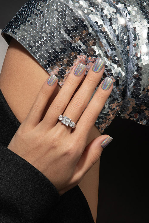 Short metallic holographic nails are one of the cutest manicure designs for spring 2024