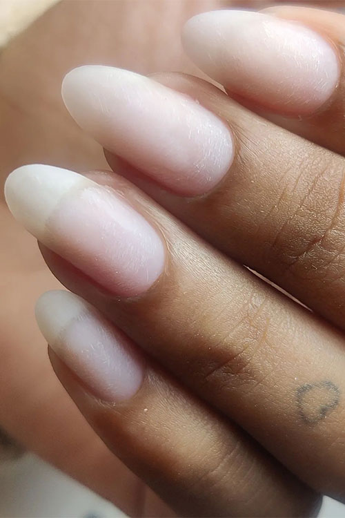 Take a buffer and gently buff the surface of your nails. This helps to smooth out any ridges and gives your nails a healthy shine. Take a buffer and gently buff the surface of your nails. This helps to smooth out any ridges and gives your nails a healthy shine.